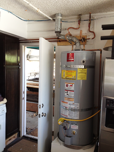 Water heater installed in garage by a plumber in Tukwila, Washington